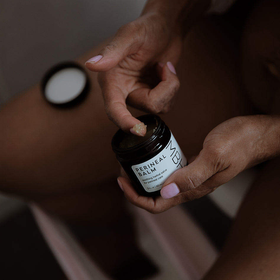 Natural perineal balm with arnica and tea tree — rich, soothing texture