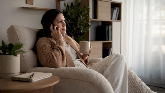 Mother receiving maternal mental health support call at home