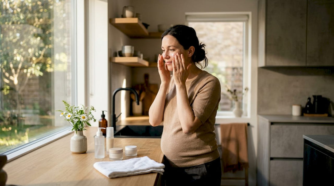 Pregnant woman applying skincare in bathroom