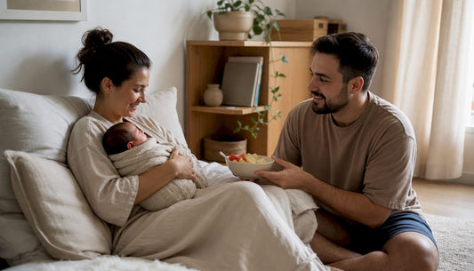 Mother receiving support with newborn at home