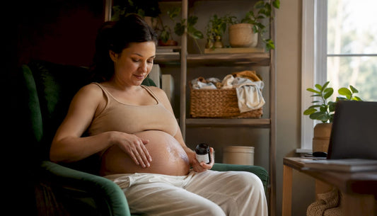 Pregnant woman applying aloe vera gel to belly