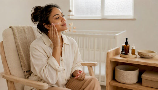 New mother applying gentle skincare at home