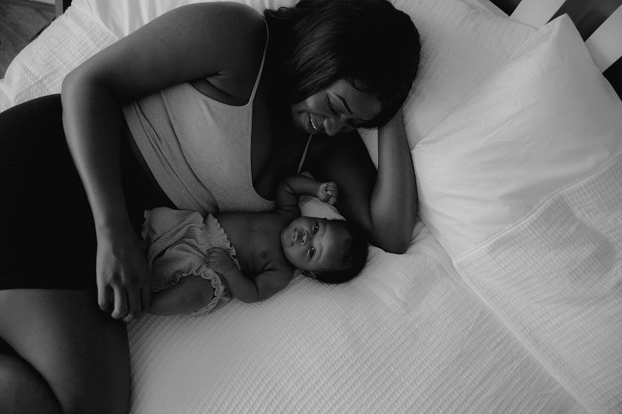 Flat-lay of new mum with soft background